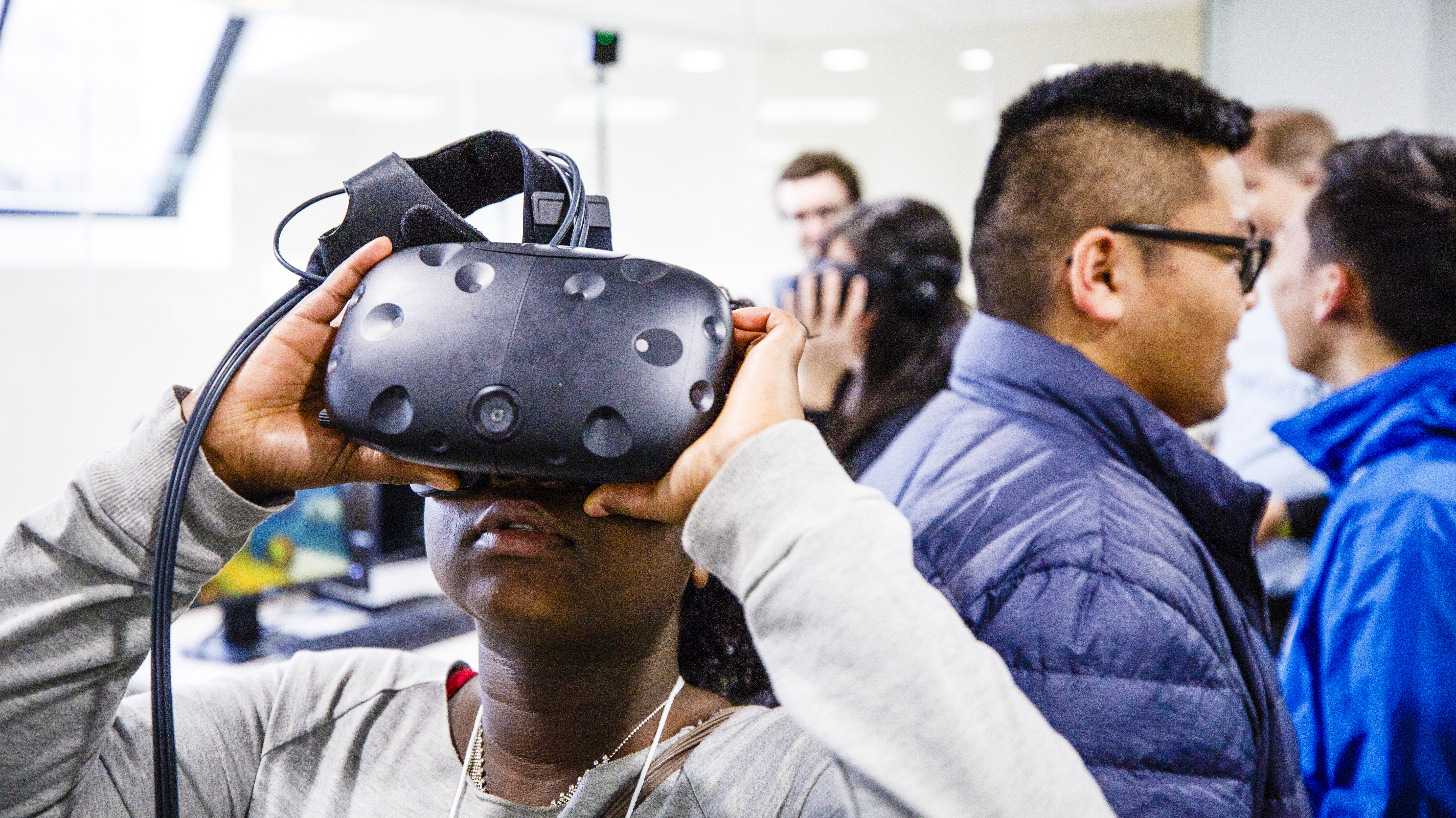 A student uses virtual reality at the Youth Digital Media Summit in February.